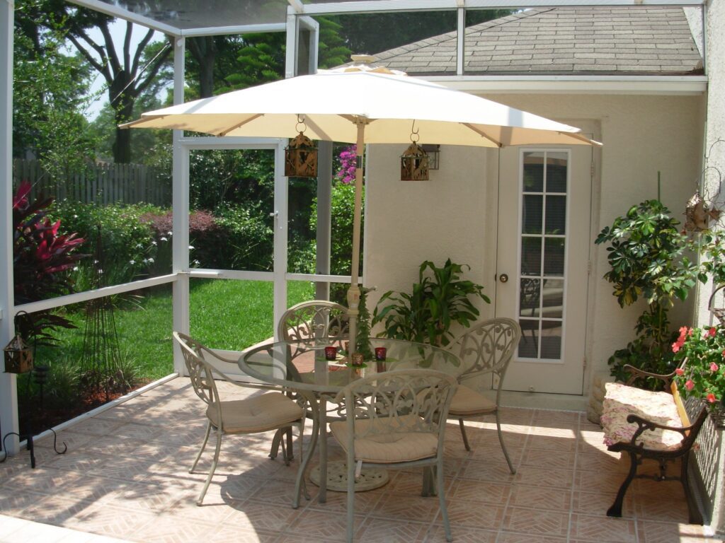 Detached Garage with Small Covered Patio Behind It